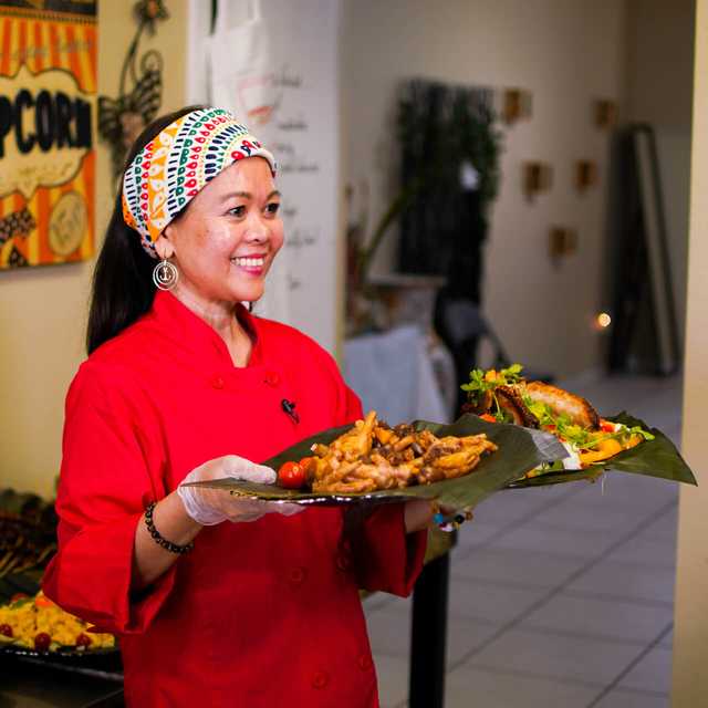 Chona from The Golden Spoon serving up Filipino cuisine.