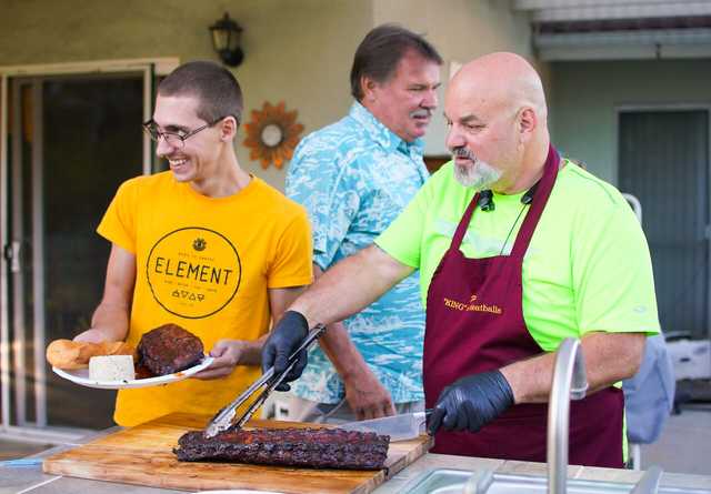 Frank serving up BBQ.