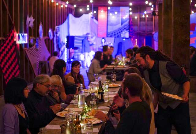 group of people eating around the dinner table